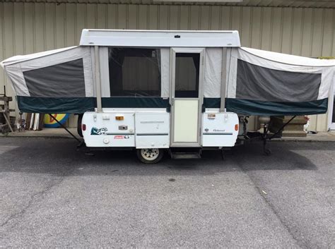 Queen bed, double bed and dining table turns to another bed. . Coleman popup camper